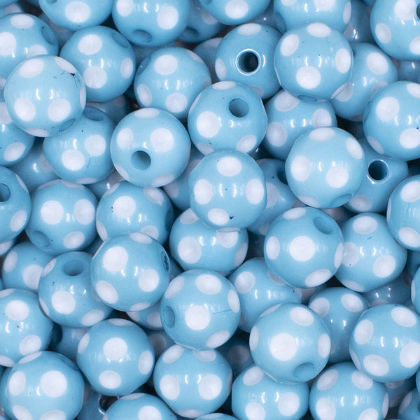 Close up view of a pile of  12mm Ice Blue with White Polka Dot Acrylic Chunky Bubblegum Beads