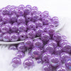 front view of a pile of 12mm Iris Purple AB Solid Acrylic Bubblegum Beads