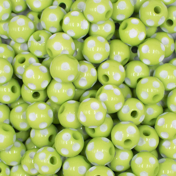 close up view of a pile of 12mm Lime Green with White Polka Dot Acrylic Chunky Bubblegum Beads