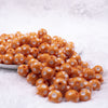 front view of a pile of 12mm Orange with White Polka Dot Acrylic Chunky Bubblegum Beads