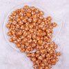 top view of a pile of 12mm Orange with White Polka Dot Acrylic Chunky Bubblegum Beads