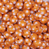 Close up view of a pile of 12mm Orange with White Polka Dot Acrylic Chunky Bubblegum Beads