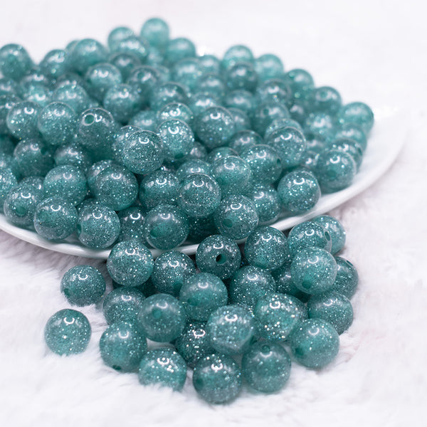 front view of a pile of 12mm Aqua Blue Shimmer Glitter Sparkle Bubblegum Beads - 20 Count