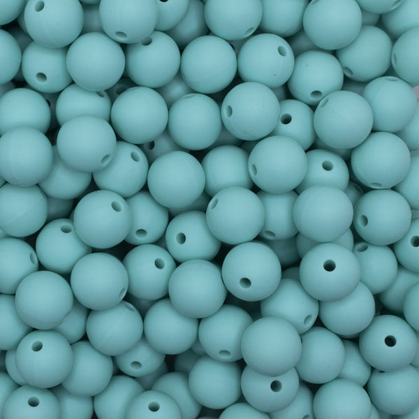 close up view of a pile of 12mm Aqua Green Round Silicone Bead