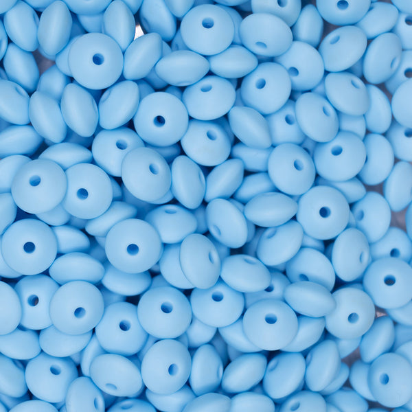 top view of a pile of 12mm Baby Blue Lentil Silicone Bead