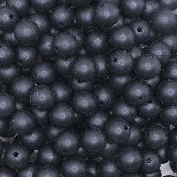 close up view of a pile of 12mm Black Round Silicone Bead