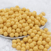Front view of a pile of 12mm Blonde Yellow Solid Acrylic Bubblegum Beads [20 & 50 Count]