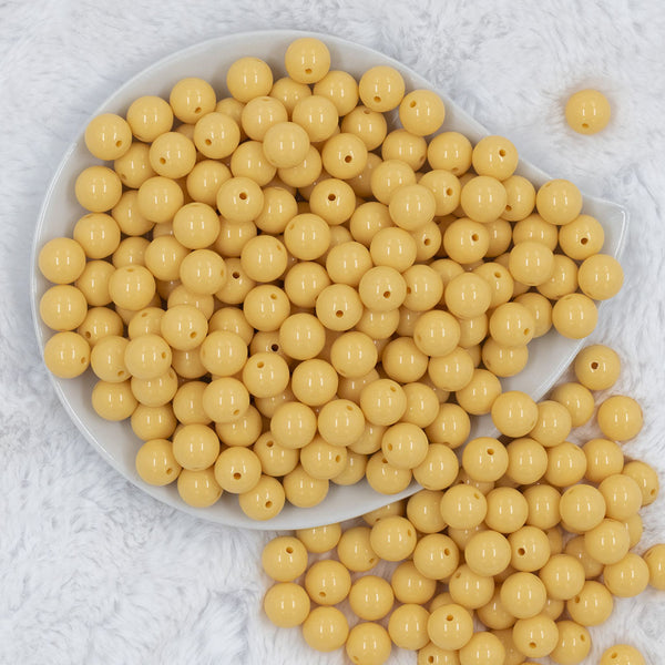 Top view of a pile of 12mm Blonde Yellow Solid Acrylic Bubblegum Beads [20 & 50 Count]