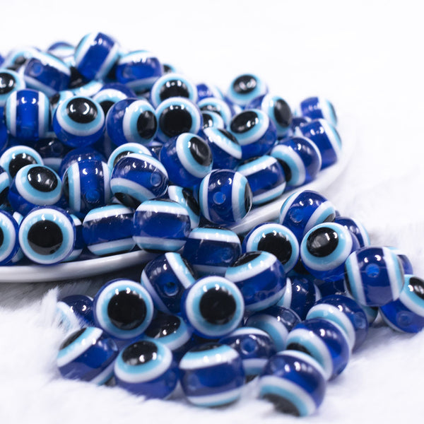 front view of a pile of 12mm Blue and Black Evil Eye Chunky Bubblegum Jewelry Beads
