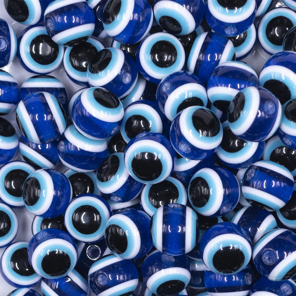 close up view of a pile of 12mm Blue and Black Evil Eye Chunky Bubblegum Jewelry Beads