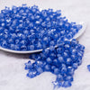 front view of a pile of 12mm Blue Transparent Star Shaped Bubblegum Beads - 20 Count