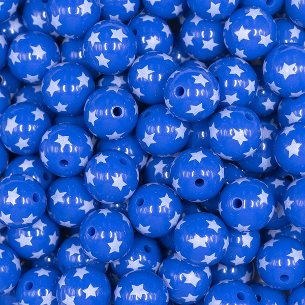 Close up view of a pile of 12mm Blue with White Stars Acrylic Bubblegum Beads