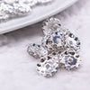 Close up view of a pile of 12MM Wavy Silver Rondelle Spacer Beads [Set of 10]