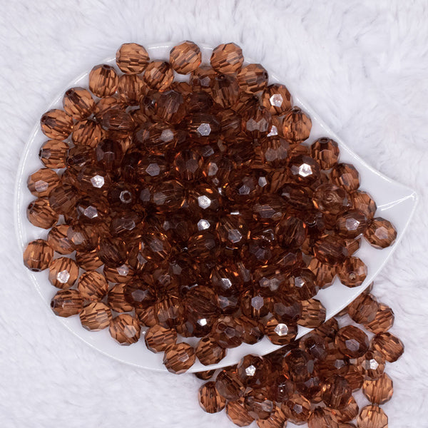 top view of a pile of 12mm Brown Transparent Faceted Shaped Bubblegum Beads