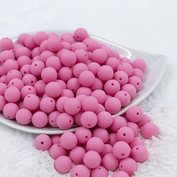 Front view of a pile of 12mm Bubblegum Pink Matte Acrylic Bubblegum Beads
