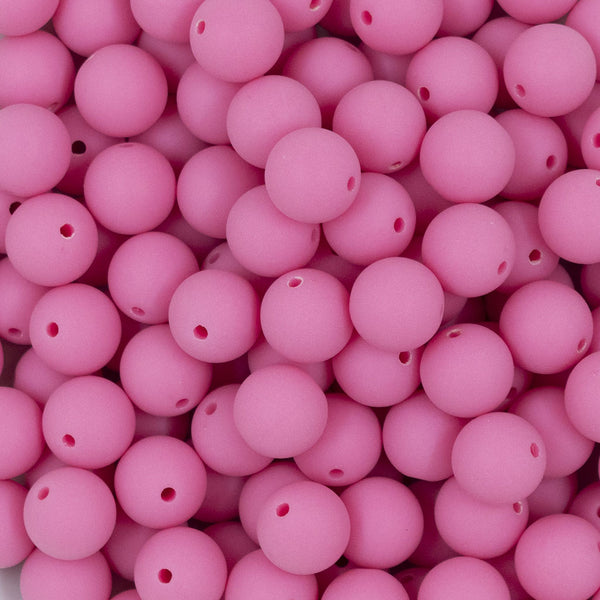Close up view of a pile of 12mm Bubblegum Pink Matte Acrylic Bubblegum Beads