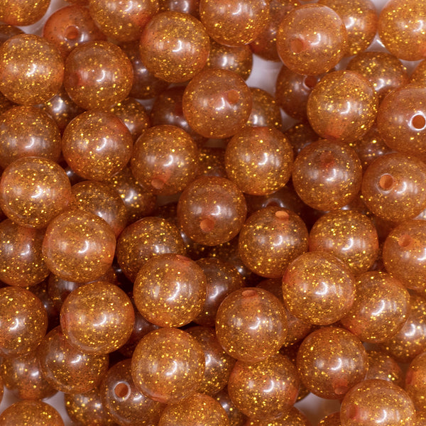 close up view of a pile of 12mm Burnt Orange Shimmer Glitter Sparkle Bubblegum Beads - 20 Count