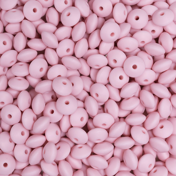 top view of a pile of 12mm Candy Pink Lentil Silicone Bead