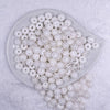 Top view of a pile of 12mm Clear with White Stripes Resin Chunky Bubblegum Beads