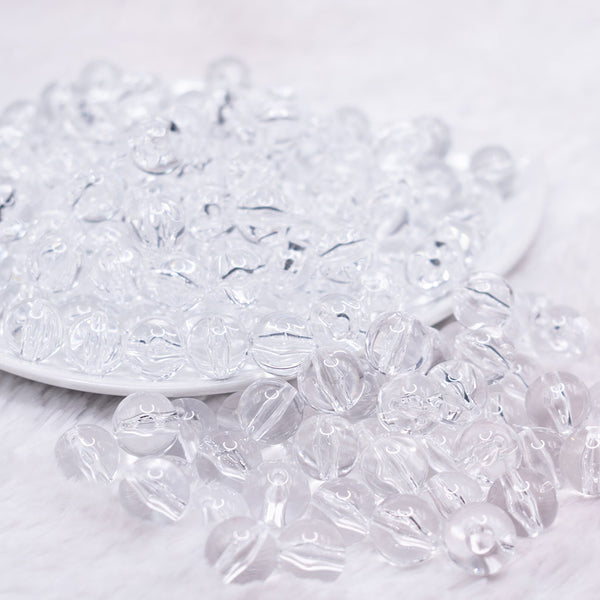 front view of a pile of 12mm Clear Solid Acrylic Bubblegum Beads