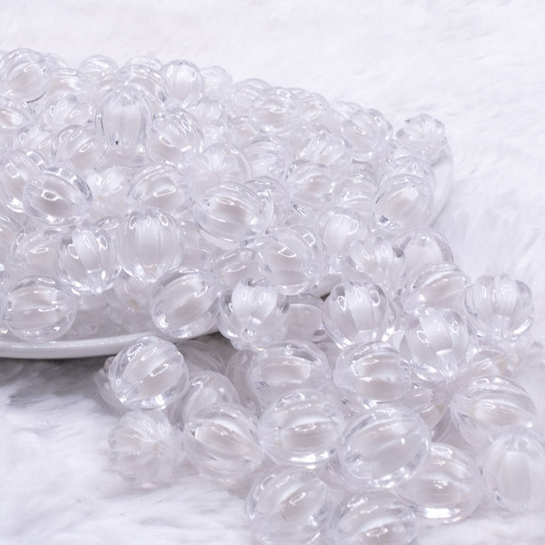 front view of a pile of 12mm Clear Transparent Pumpkin Shaped Bubblegum Beads