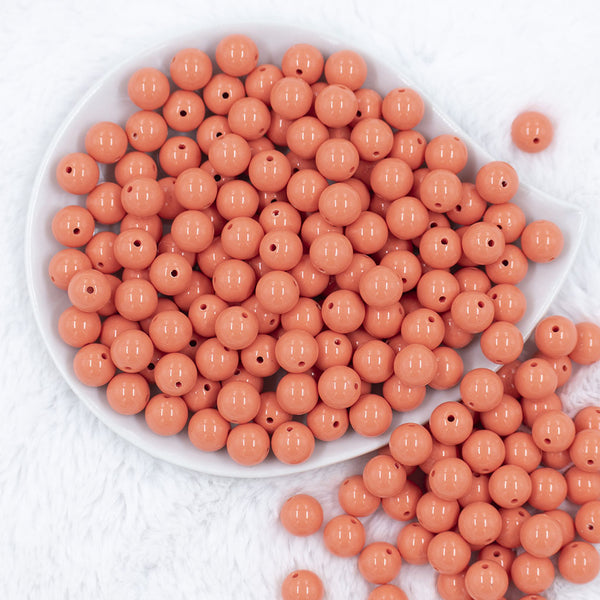 Top view of a pile of 12mm Coral Orange Acrylic Bubblegum Beads [20 & 50 Count]