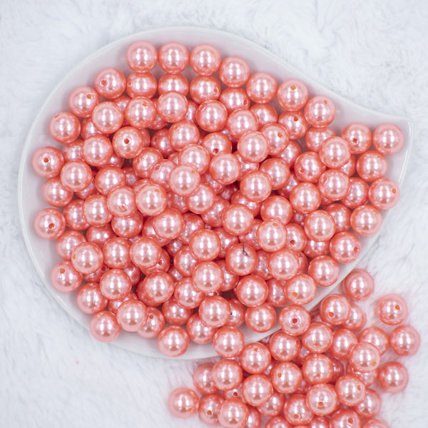 Top view of a pile of 12mm Coral Pink Faux Pearl Acrylic Bubblegum Beads [20 Count]