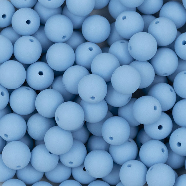 Close up view of a pile of 12mm Cornflower Blue Matte Acrylic Bubblegum Beads