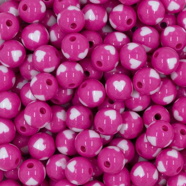 Close up view of a pile of 12mm Cotton Candy Pink with White Heart Chunky Acrylic Bubblegum Beads [20 Count]