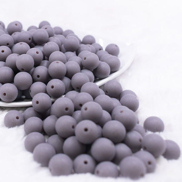 Front view of a pile of 12mm Dark Gray Matte Acrylic Bubblegum Beads