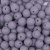 Close up view of a pile of 12mm Dark Gray Matte Acrylic Bubblegum Beads