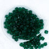 Top view of a pile of 12mm Green Transparent Cube Faceted Bubblegum Beads