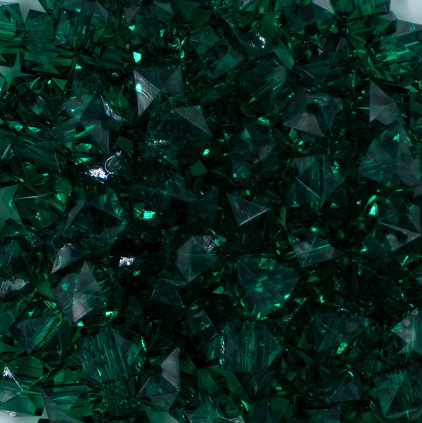 Close up view of a pile of 12mm Green Transparent Cube Faceted Bubblegum Beads