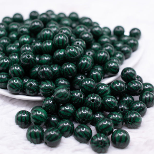 front view of a pile of 12mm Dark Green Watermelon Pattern Print Bubblegum Beads
