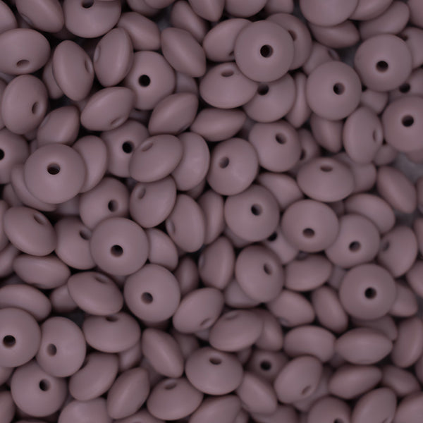 top view of a pile of 12mm Dark Pink Lentil Silicone Bead