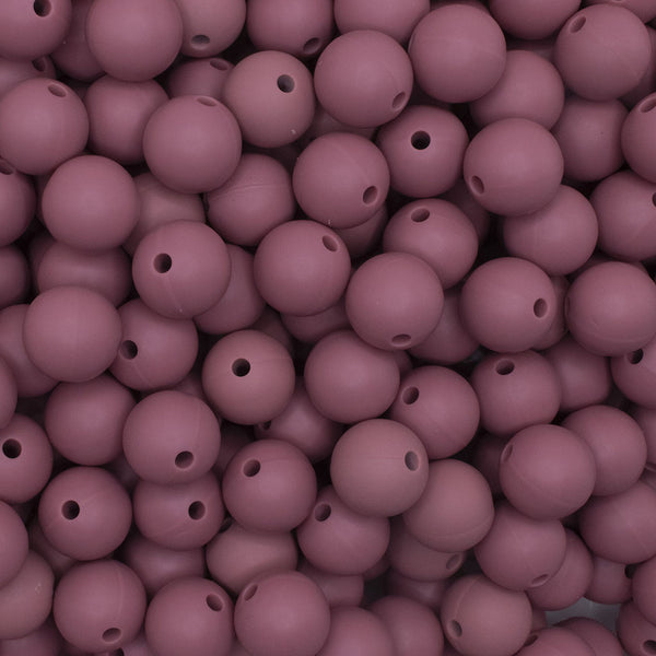 close up view of a pile of 12mm Dark Pink Round Silicone Bead