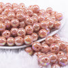 front view of a pile of 12mm Dark Salmon AB Solid Acrylic Bubblegum Beads