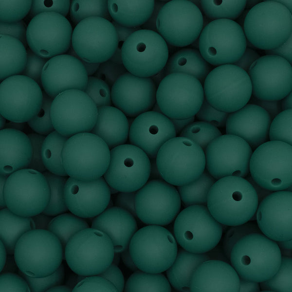 close up view of a pile of 12mm Deep Green Round Silicone Bead