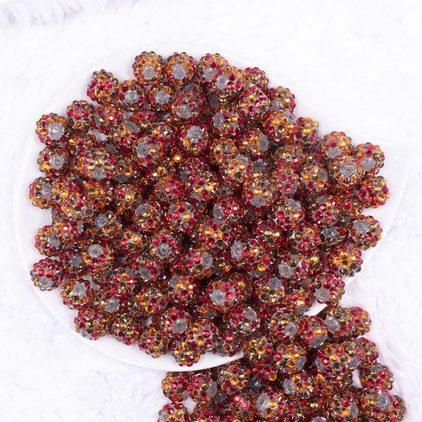 top view of a pile of 12mm Red, Brown & Orange Confetti Rhinestone AB Bubblegum Beads