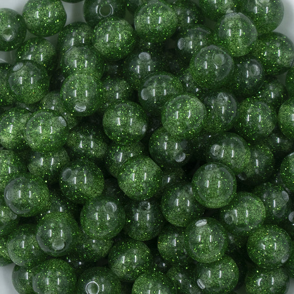 Close up view of a pile of 12mm Green Glitter Sparkle Chunky Acrylic Bubblegum Beads