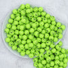 Top view of a pile of 12mm Grinch Smirk Face Print Chunky Acrylic Bubblegum Beads [20 Count]