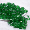 front view of a pile of 12mm Green Transparent Faceted Shaped Bubblegum Beads