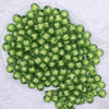 top view of a pile of 12mm Green Transparent Pumpkin Shaped Bubblegum Beads