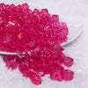 front view of a pile of 12mm Hot Pink Transparent Cube Faceted Bubblegum Beads
