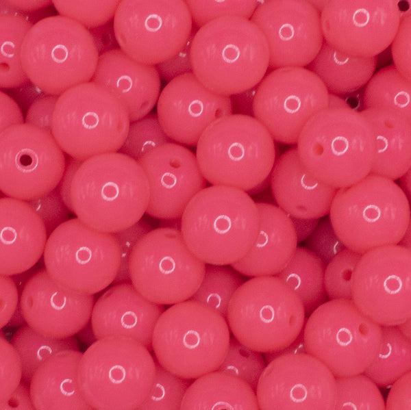 close up view of a pile of 12mm Hubba Bubba Pink Solid Acrylic Bubblegum Beads