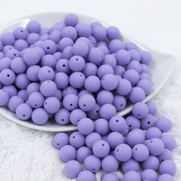 Front view of a pile of 12mm Iris Purple Matte Acrylic Bubblegum Beads