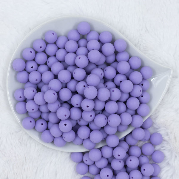 Top view of a pile of 12mm Iris Purple Matte Acrylic Bubblegum Beads