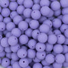 Close up view of a pile of 12mm Iris Purple Matte Acrylic Bubblegum Beads
