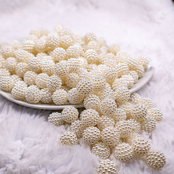 Front view of a pile of 12mm Off White Ball Bead Chunky Acrylic Bubblegum Beads