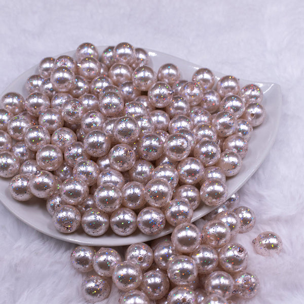 Front view of a pile of 12mm Ivory with Glitter Faux Pearl Acrylic Bubblegum Beads - 20 Count